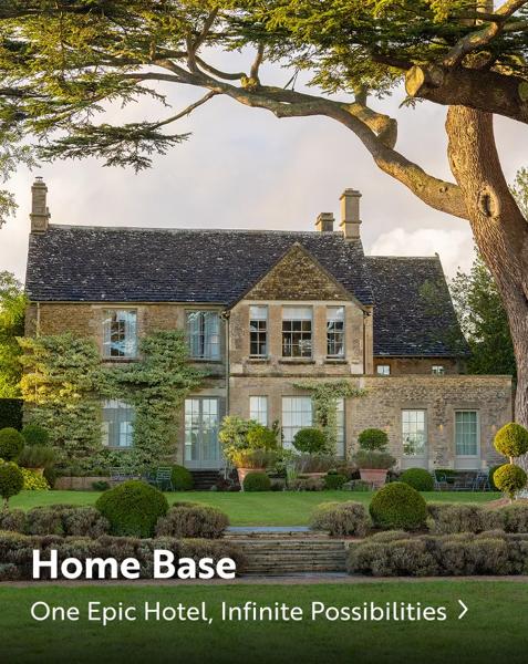 An elegant, two-story historic stone manor hotel. Text overlay reads: "Home Base. One epic hotel, infinite possibilities".