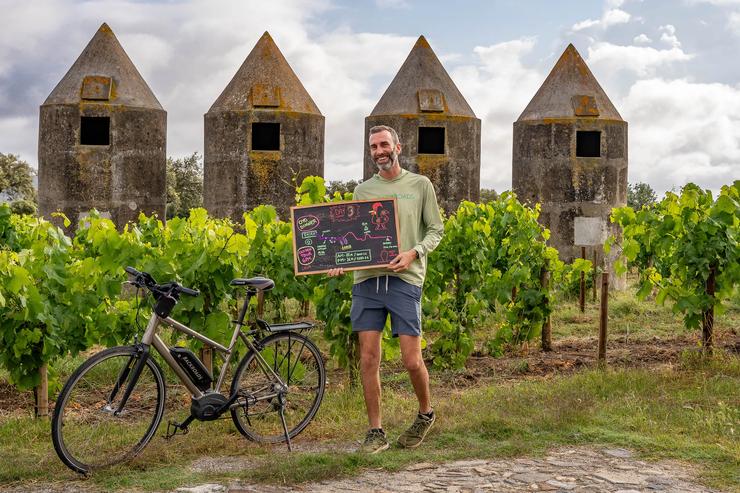 A Backroads Trip Leader gives the daily route rap against a backdrop of vineyards in Portugal.
