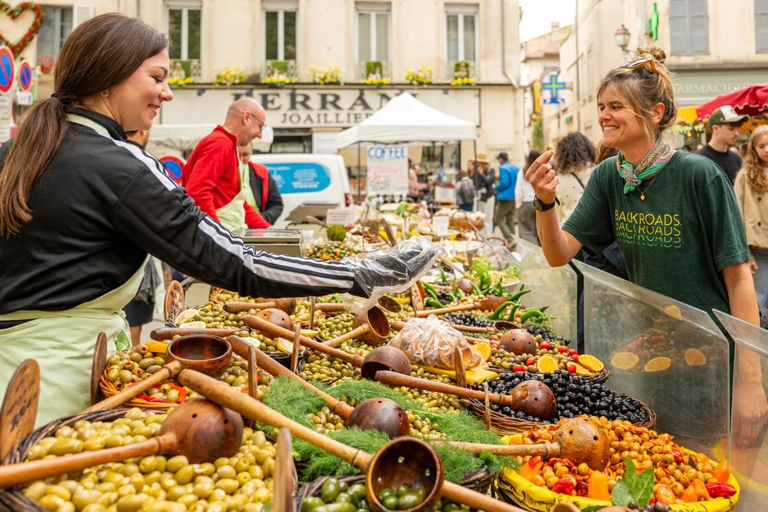 Food shopping in an open market in Provence.