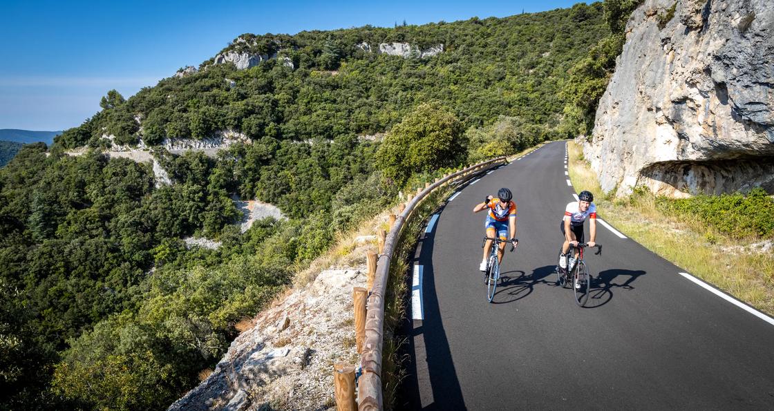 Cycling down a winding mountain road on the Backroads Provence Wine Country to Luberon Bike Tour
