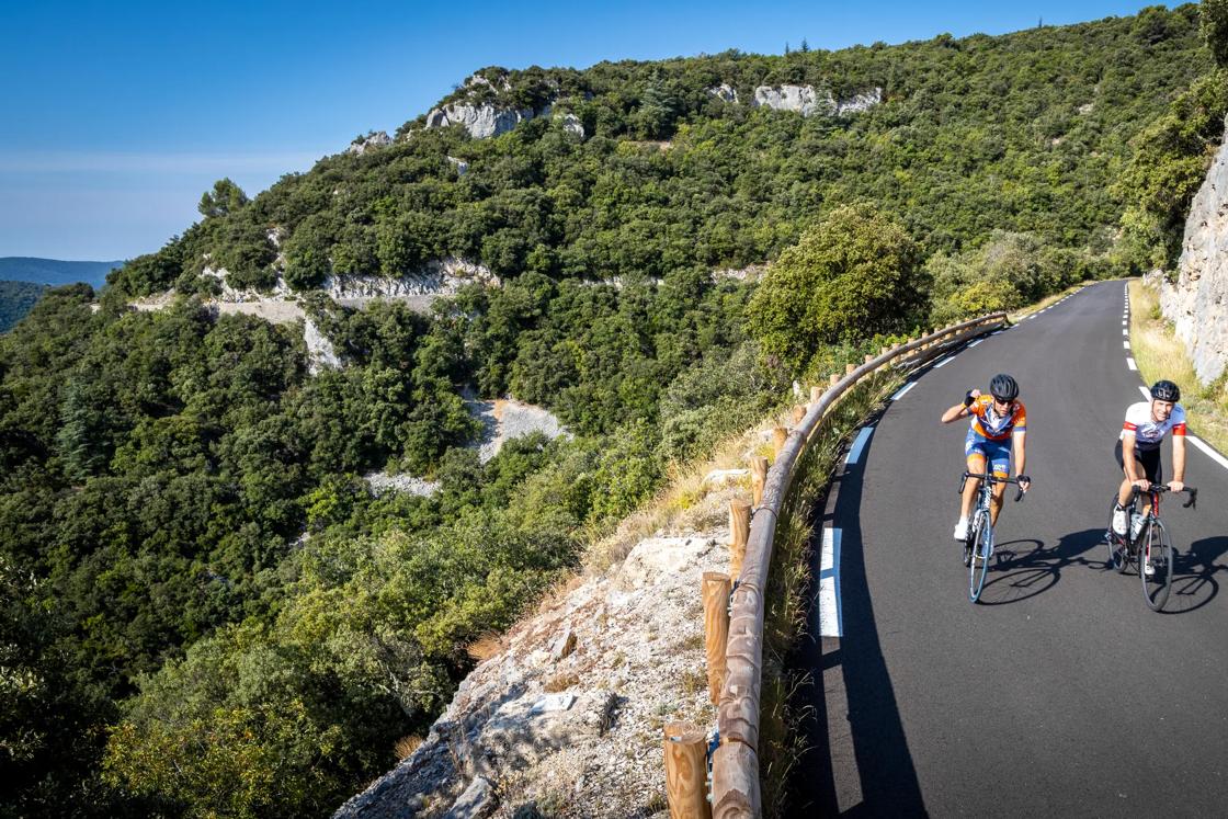 Cycling down a winding mountain road on the Backroads Provence Wine Country to Luberon Bike Tour