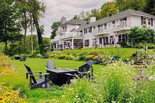 Manoir Hovey, a luxury 5-star Relais & Châteaux lakeside resort in North Hatley, Quebec, Canada features landscaped garden grounds with wildflowers.