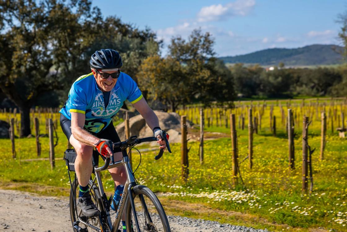 Cycling past vineyards on the B ackroads Portugal's Algarve & Alentejo Bike Tour
