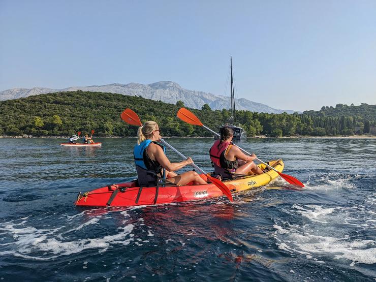 Kayaking along the sunny Croatian coast.