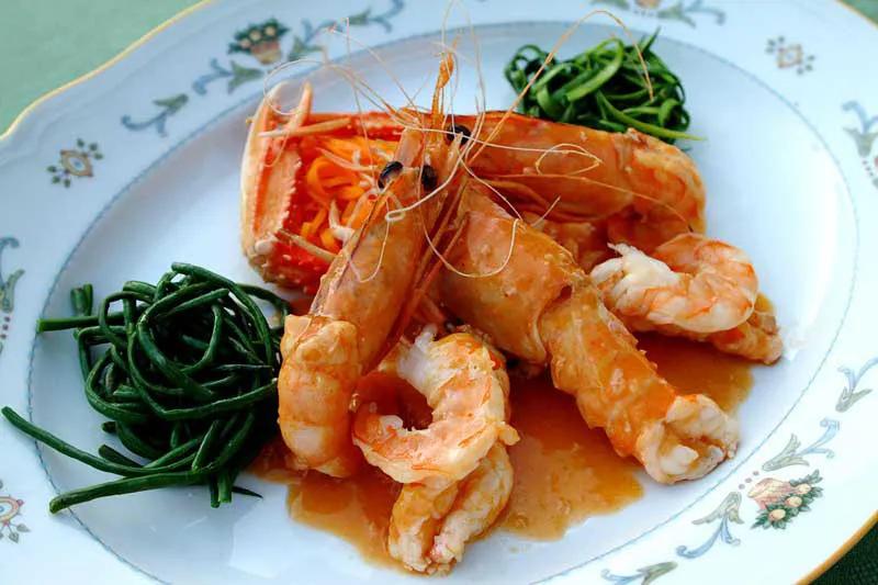 A dinner plate of prawns.