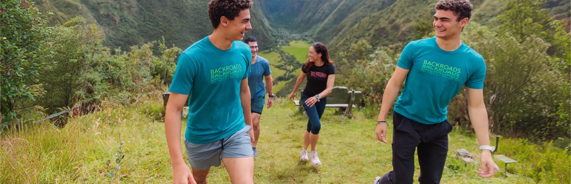 A family hiking in the Andes during a Backroads Galápagos & Andes Family Multi-Adventure Tour.