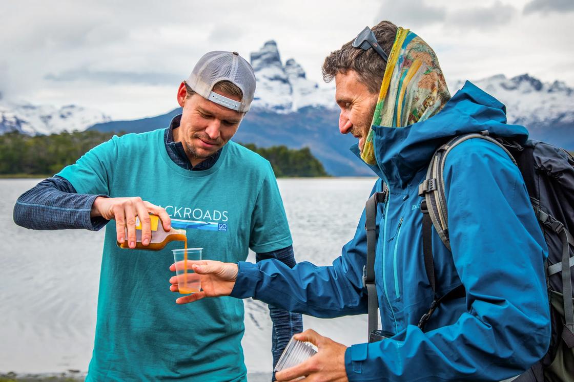 Stopping for a refreshing drink while hiking in Chile's Patagonia.