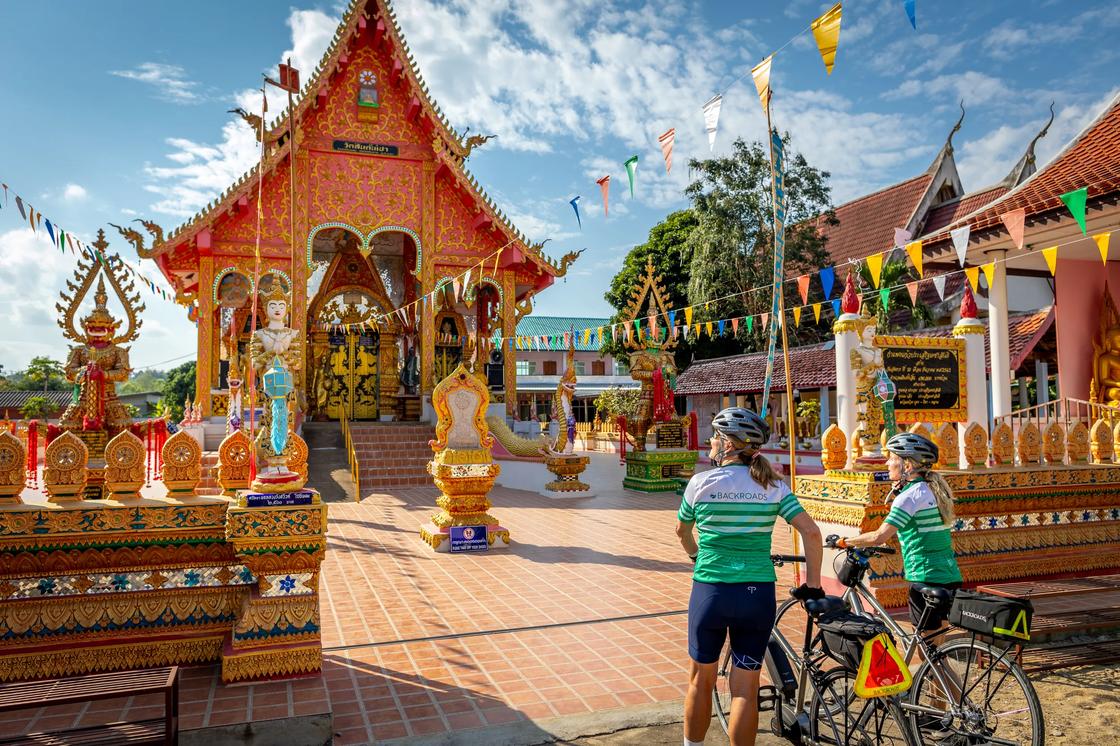 Two Backroads cyclists at a temple complex in Thailand