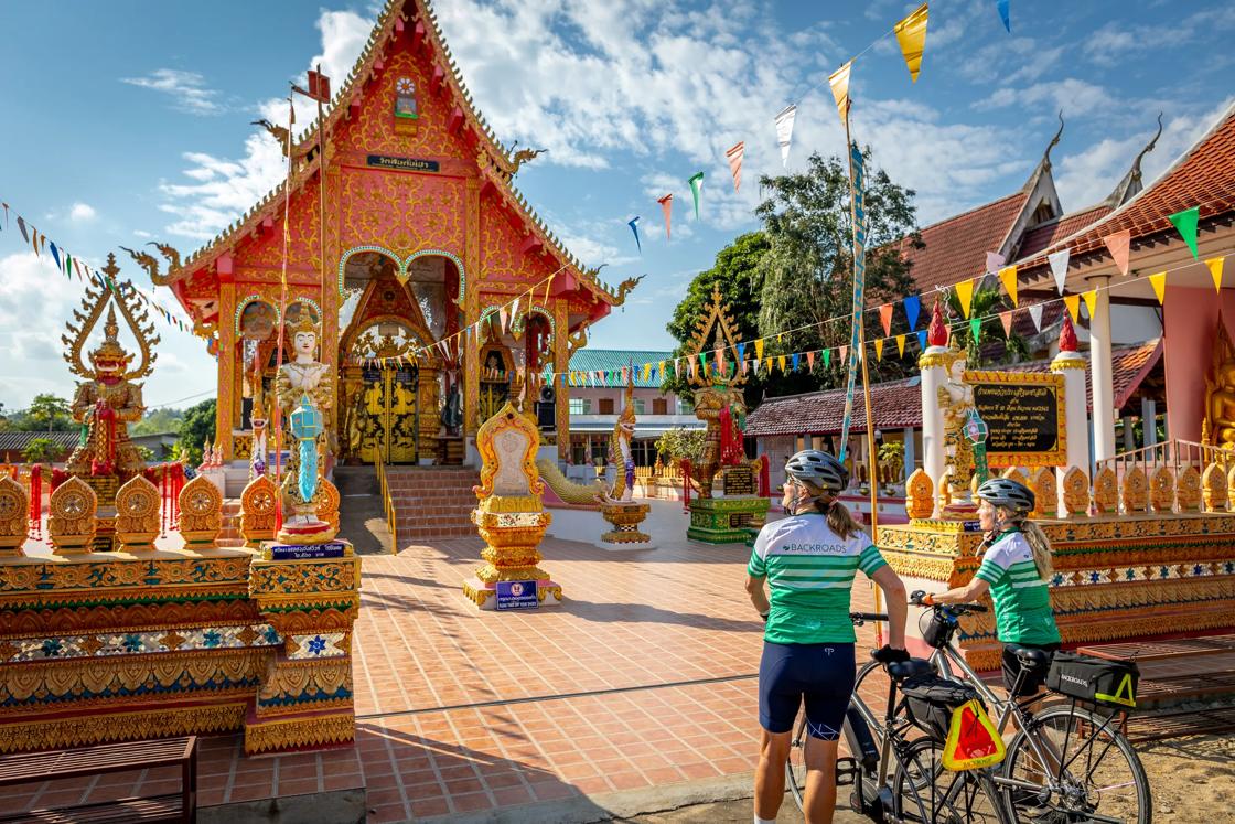 Two Backroads cyclists at a temple complex in Thailand