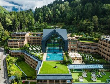 Aerial view of the modern, alpine Lefay Resort & SPA Dolomiti located in Pinzolo (near Madonna di Campiglio), Trentino-Alto Adige, Italy.