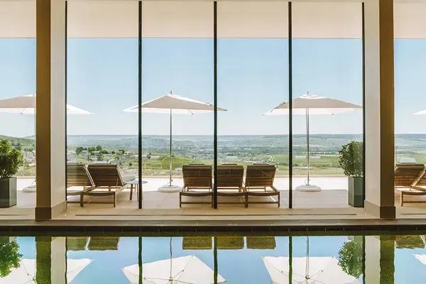 The indoor swimming pool overlooking the vineyards at the Royal Champagne Hotel & Spa in Champillon, France.