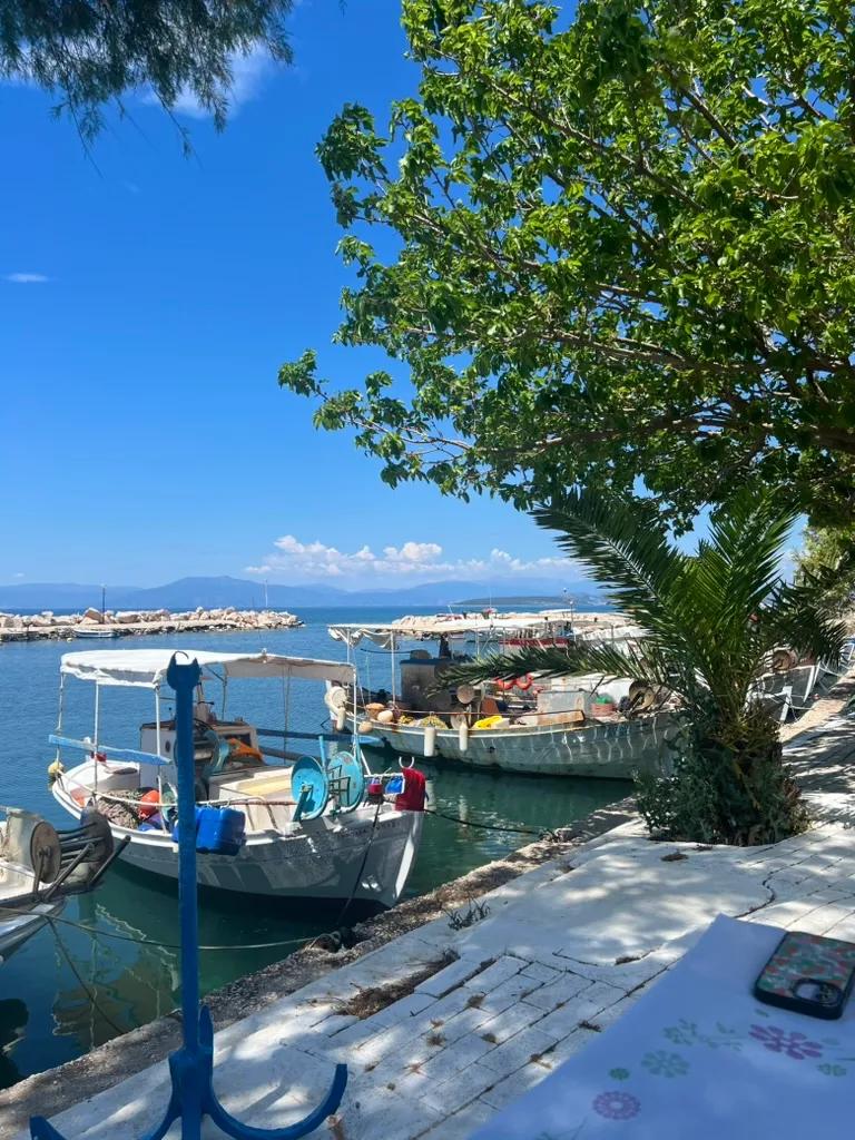 Small boats line the harbor in Greece.