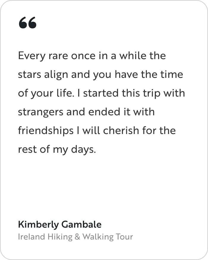 A testimonial card featuring a quote from a traveler named Kimberly Gambale from the Ireland Hiking & Walking Tour. The main body text reads: "Every rare once in a while the stars align and you have the time of your life. I started this trip with strangers and ended it with friendships I will cherish for the rest of my days." 