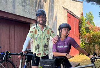 Joey and Shauna, two Backroads Trip Leaders, pose with their bikes on a trip.
