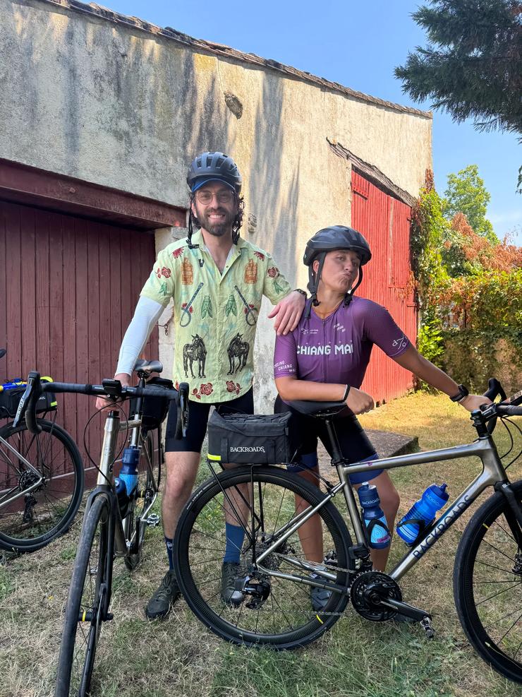 Joey and Shauna, two Backroads Trip Leaders, pose with their bikes on a trip.
