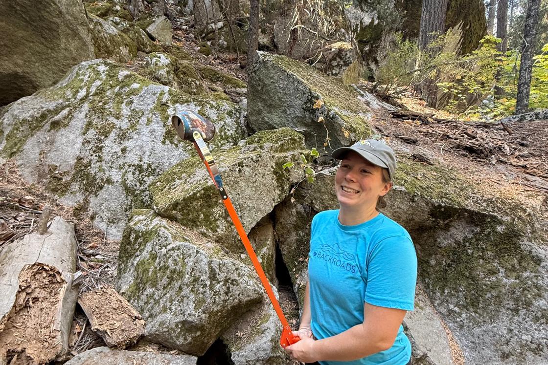 A Backroads employee picking up trash from around Mirror Lake during Yosemite FaceLift 2026.