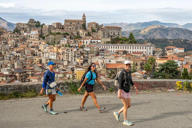 Three women on a Backroads trip take a walk in Sicily.
